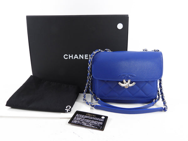 My new mini Chanel bag in cobalt blue with pink wool pom-poms from