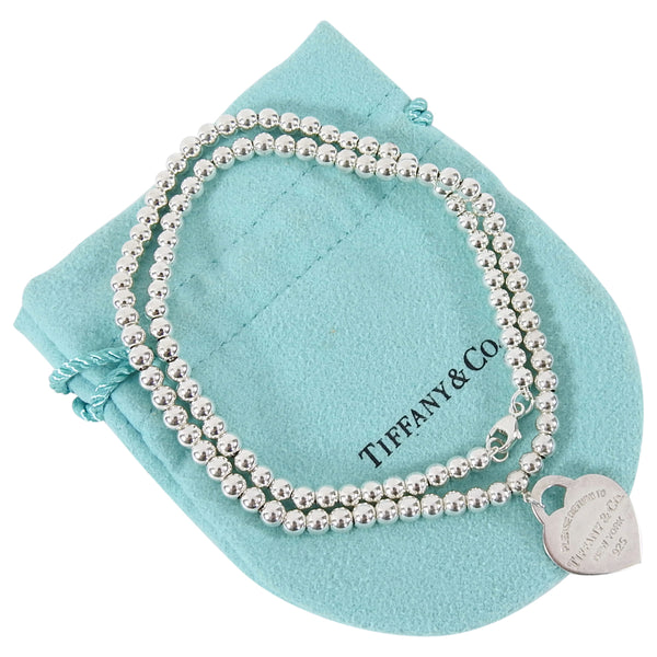 Return to Tiffany® small heart tag in sterling silver on a bead necklace.