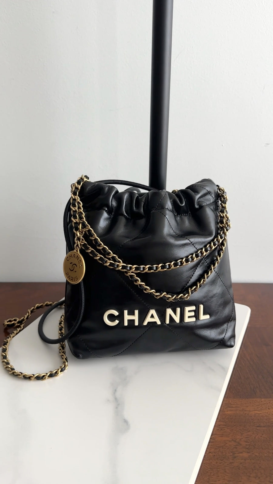 Chanel 2023 Black Leather Chain 22 Mini Bag with Ivory Enamel Logo