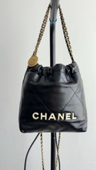 Chanel 2023 Black Leather Chain 22 Mini Bag with Ivory Enamel Logo