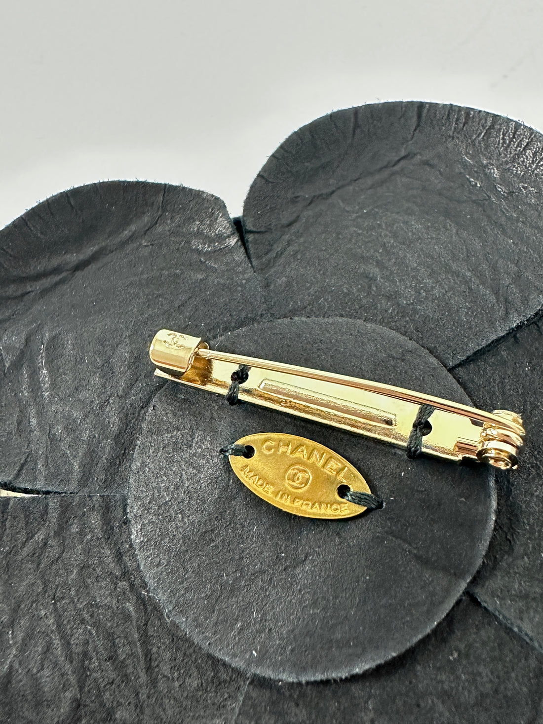 Chanel Black Leather Camelia Flower Brooch Pin with Metal Petal