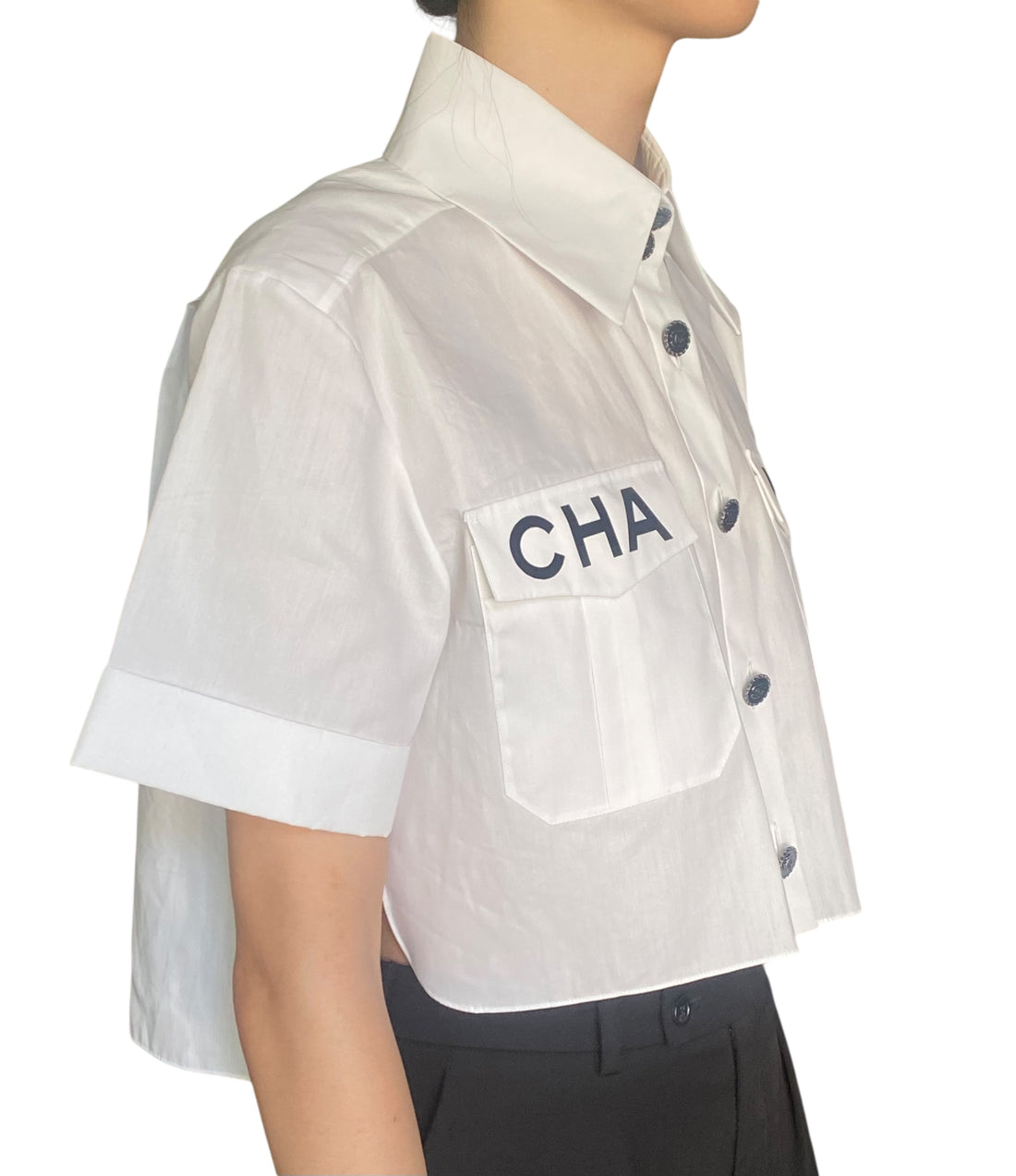 chanel white dress shirt chanelofficial Spring/Summer 2026 RTW is coming!! A first glimpse introduces us to a crisp white shirt, with classic Chanel script and chain and pearl details A true timeless, classic
