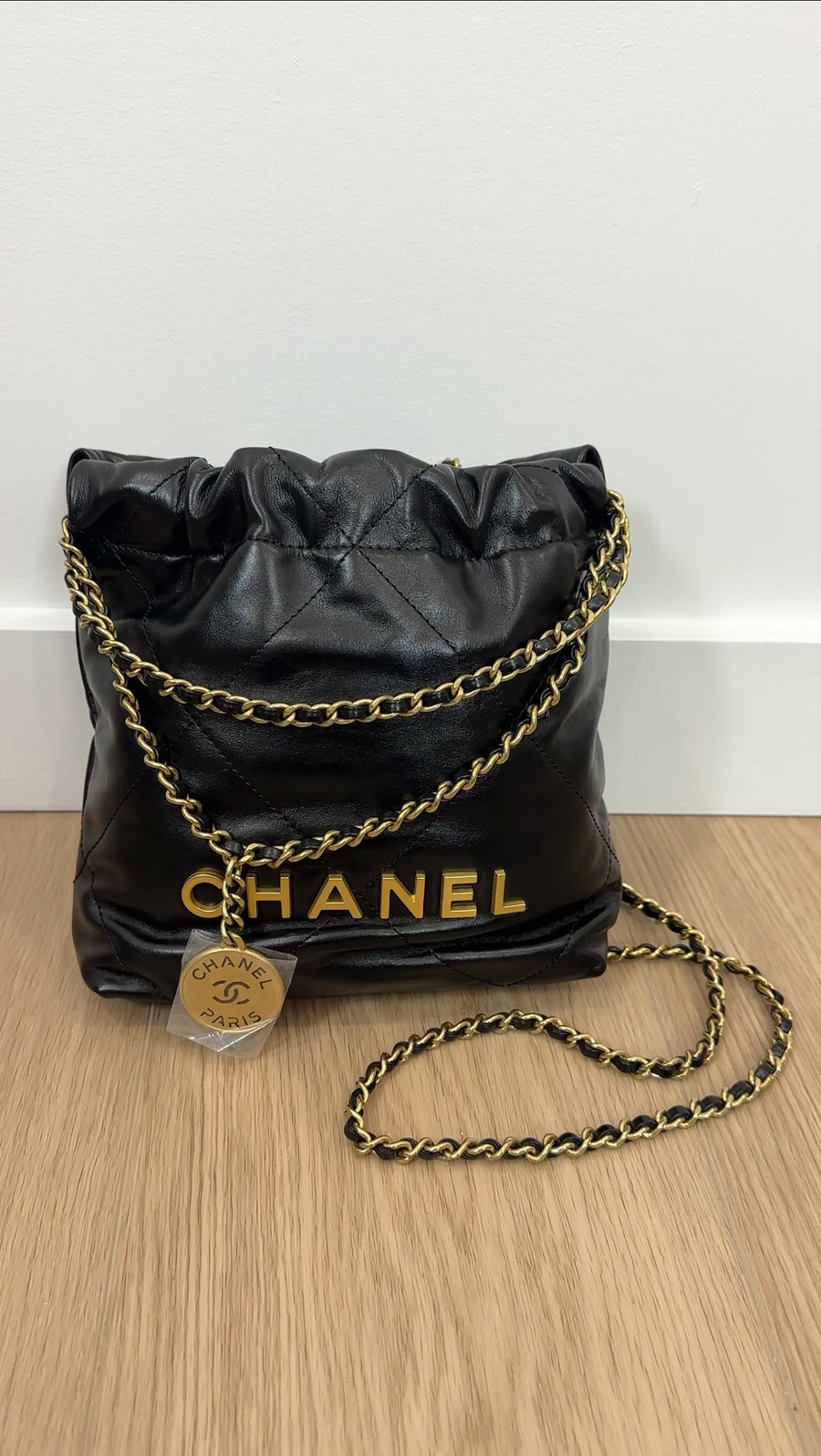 Chanel Black Leather Chain 22 Mini Bag with Goldtone Spellout Logo