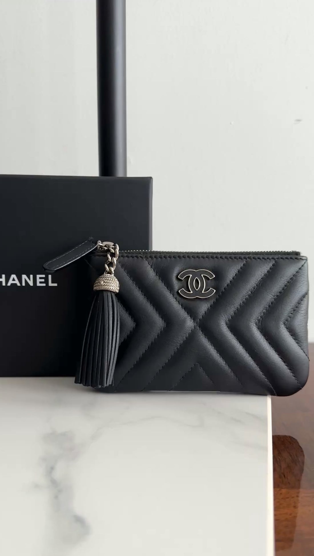 Chanel Black Leather Chevron Tassel Mini Zip Pouch
