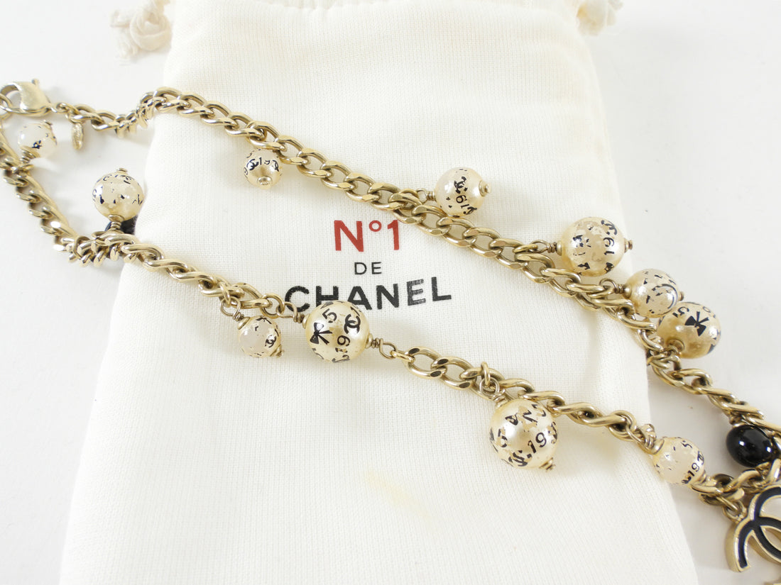 Chanel 06A Faux Pearl, Resin and Enamel CC Charm Gold Tone Chain Necklace