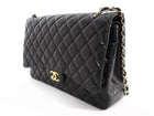 Chanel Black Lambskin CC Maxi Classic Double Flap GHW