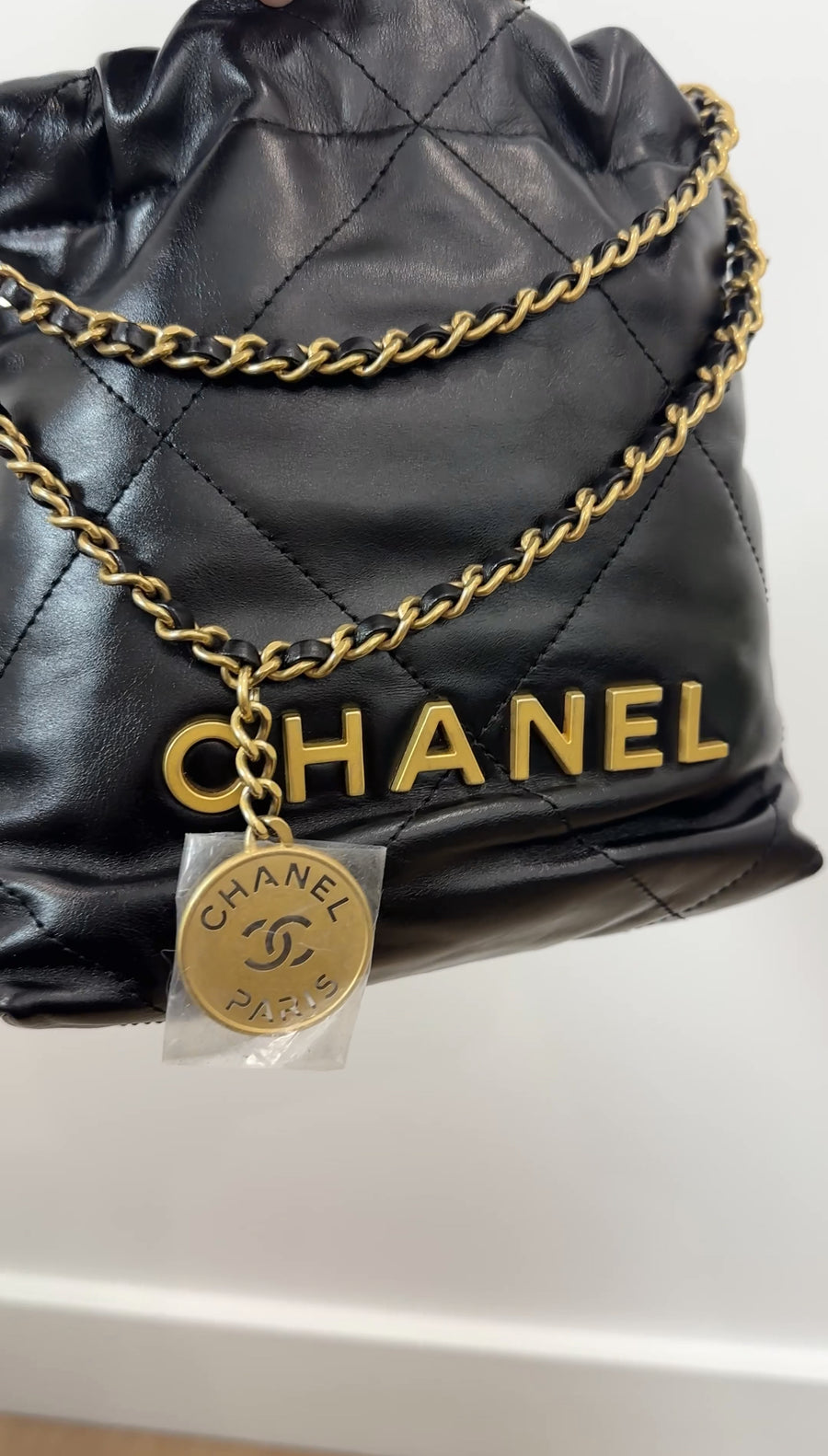 Chanel Black Leather Chain 22 Mini Bag with Goldtone Spellout Logo