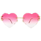 Heart-shaped sunglasses with pink gradient lenses on a white background