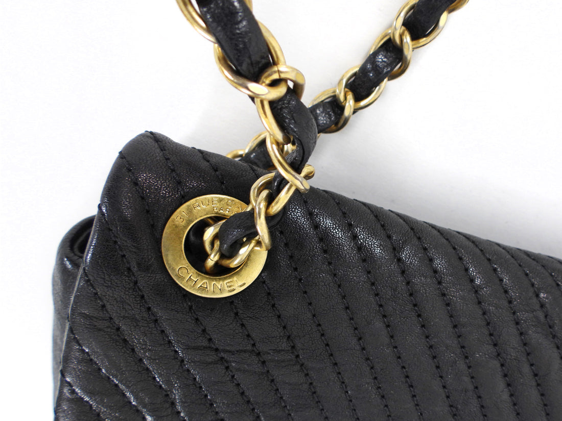 Chanel Surpique Chevron Black Quilted Leather Medium Flap Bag