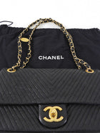 Chanel Surpique Chevron Black Quilted Leather Medium Flap Bag