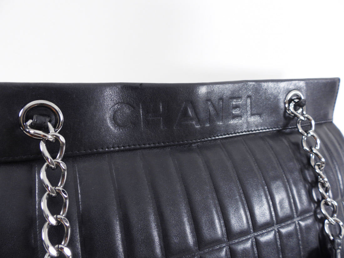 Authentic Chanel 2003 Black Solid Lambskin Leather Bag on sale at JHROP.  Luxury Designer Consignment Resale @jhrop_official