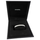 Chanel jewelry box with coco crush diamond bracelet inside on a white background