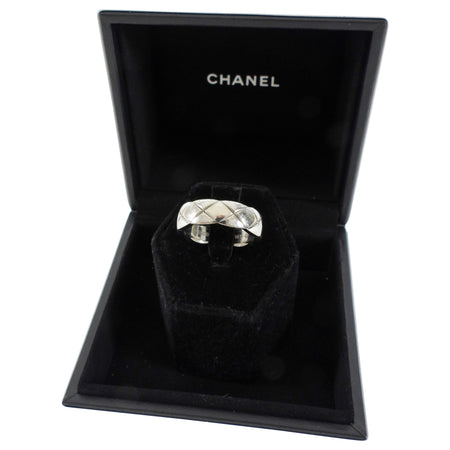 Silver ring in a Chanel jewelry box on a white background