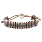 Links of London Sterling Bracelet with gray and bronze beads on a white background