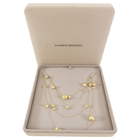 Gold necklace in a Marco Bicego box on a white background