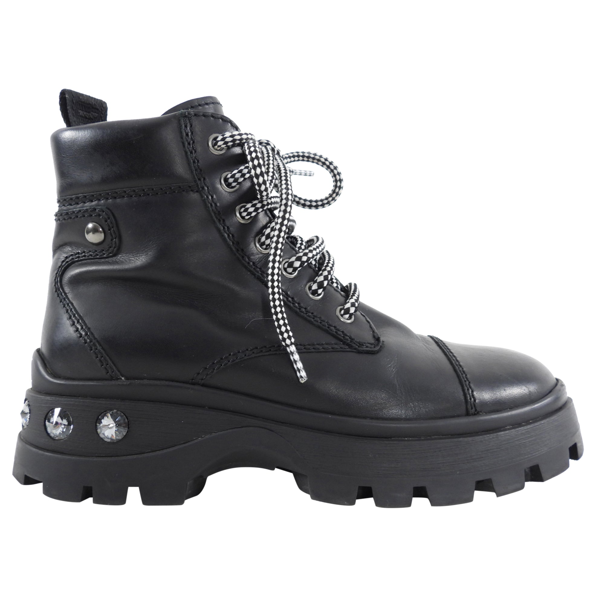 シューズ・サンダルその他 MIU MIU ANTIQUED LEATHER COMBAT BOOTS Leather combat boots in black - Miu Miu | Mytheresa
