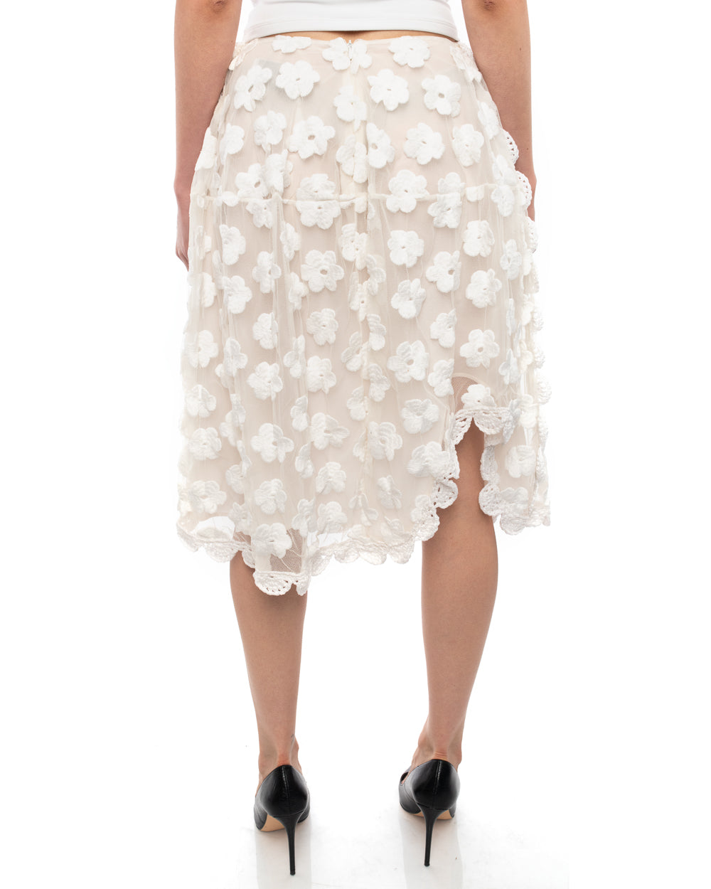 Simone Rocha White Floral Crochet Mesh Overlay Skirt.  Below knee length full skirt with raised hemline at left knee, silk lined, no waistband.  Marked size UK6 (USA 2) but can fit a USA 4/6 as waist measures 27”, total length is 26”.  Our model is 5’10” without heels. 65% cotton, 32 polyamide, 3 poly.  Crochet is 100% poly and lining is 100% silk.  Excellent preowned condition.