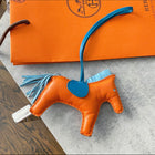 Hermes Gri Gri Rodeo MM Horse Bag charm Orange / Celeste Blue