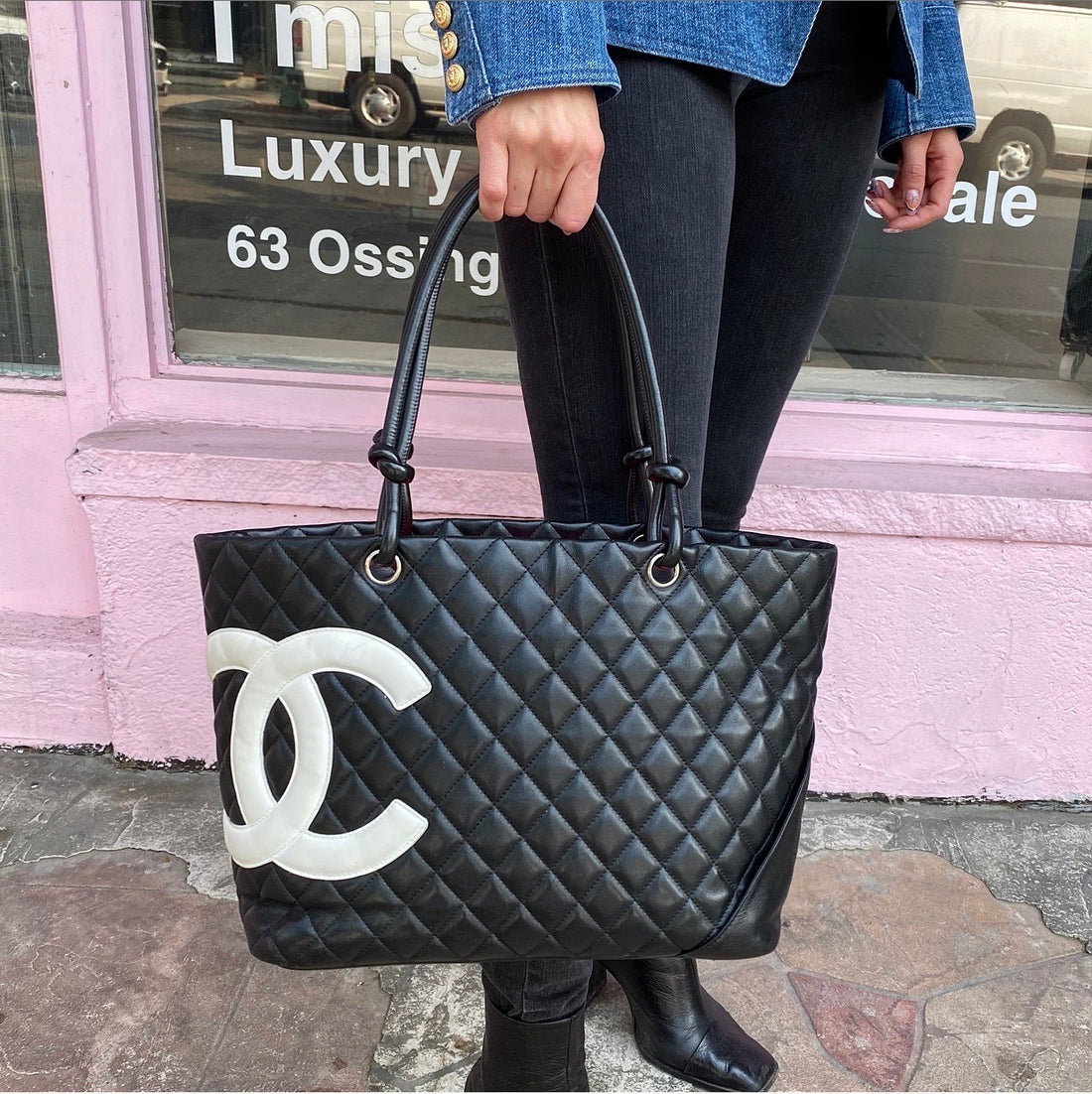 black chanel purse with white logo