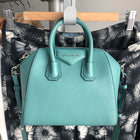 Givenchy Aqua Blue Antigona Mini Crossbody Bag.  Silvertone metal, double rolled leather handles, long crossbody strap.  Measures 8.75 x 75 x 5.25” with a 22” strap drop.  Excellent condition - as new except for a small blemish on back top handle as pictured. 