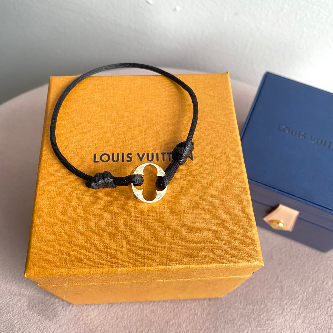 Louis Vuitton Empreinte 18 Karat White Gold Charm Bracelet with Pink Silk  Cord