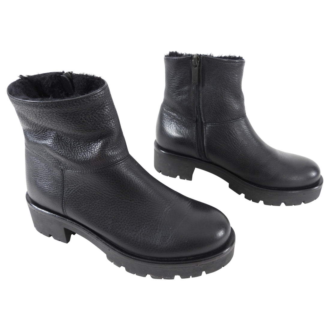 Aquatalia Black Leather Shearling Ankle Boots.  Round toe, rubber track sole, interior ankle zipper, and shearling lined interior.  Size 37.  Excellent gently pre-owned condition.  Without box or duster.