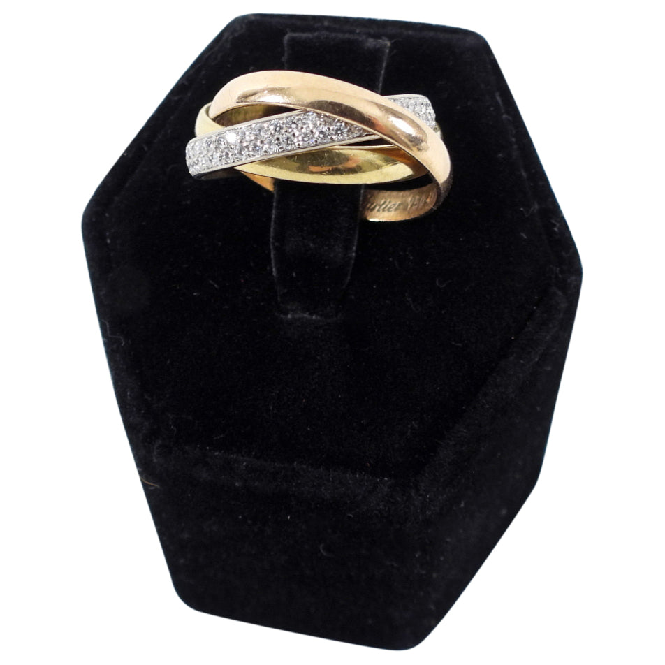 Trinity ring, small model, 18K white gold, 18K pink gold, 18K yellow gold, set with 102 brilliant-cut diamonds totaling 0.46 carat. All-gold ring width: 2.8 mm. Paved ring width: 2.9 mm.