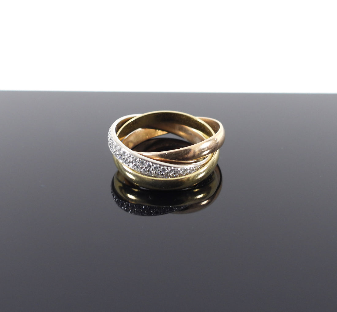 Trinity ring, small model, 18K white gold, 18K pink gold, 18K yellow gold, set with 102 brilliant-cut diamonds totaling 0.46 carat. All-gold ring width: 2.8 mm. Paved ring width: 2.9 mm.