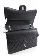 Chanel Black Caviar Maxi Classic Double Flap Bag