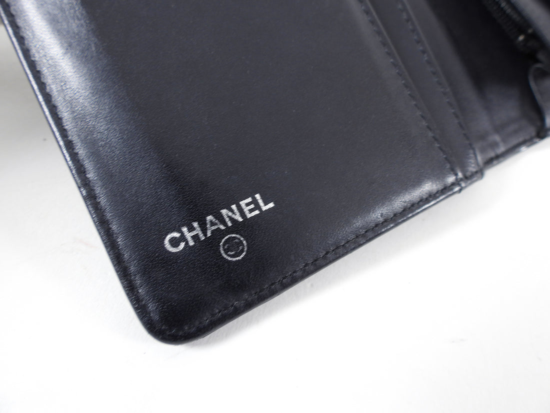 Chanel Black Patent Embossed Camelia Bifold Yen Wallet