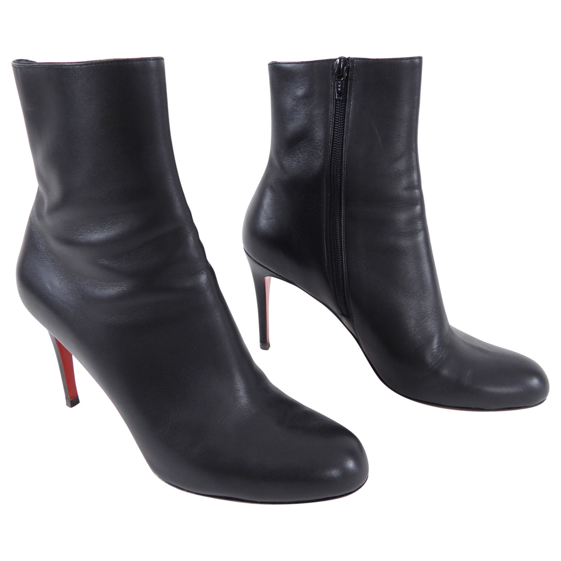 Christian Louboutin Black Leather Ankle Boots.  Round toe, 95mm high heel, interior side zipper.  Marked size EU40 (USA 9.5).  Excellent pre-owned condition with resoled bottoms and some light wear to back heels as pictured.  Without duster or box.