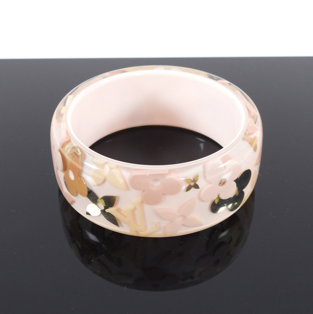 LOUIS VUITTON. Pink resin bracelet with flowers and LV l…
